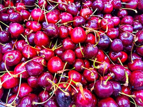 Fresh Cherries on Display at Local Market. A vibrant array of ripe cherries up close