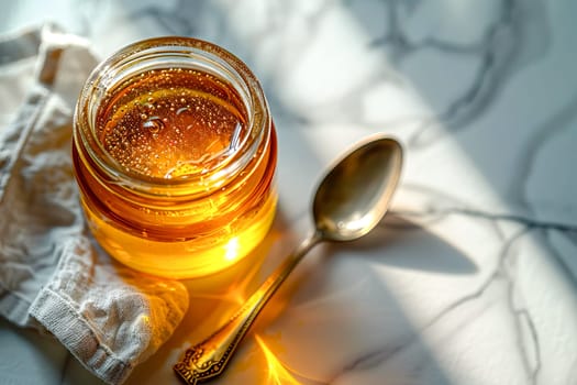 Top view, jar of ghee on a linen napkin with a spoon, light background.
