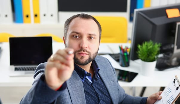 portrait of young handsome promising businessman work in office like his job