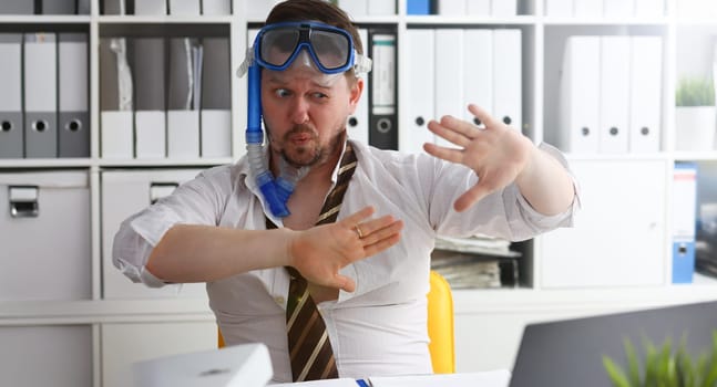 Man wearing suit and tie in goggles and snorkel articulate at workplace in office portrait. Count days to leave annual day off workaholic more task job tourism resort idea ticket sale concept