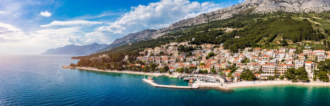 Beautiful Brela on Makarska riviera, Croatia. Adriatic Sea with amazing turquoise clean water and white sand. Aerial view of Brela beach and waterfront on Makarska riviera, Dalmatia region of Croatia.