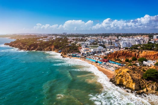 Amazing view from the sky of town Olhos de Agua in Albufeira, Algarve, Portugal. Aerial coastal view of town Olhos de Agua, Albufeira area, Algarve, Portugal.