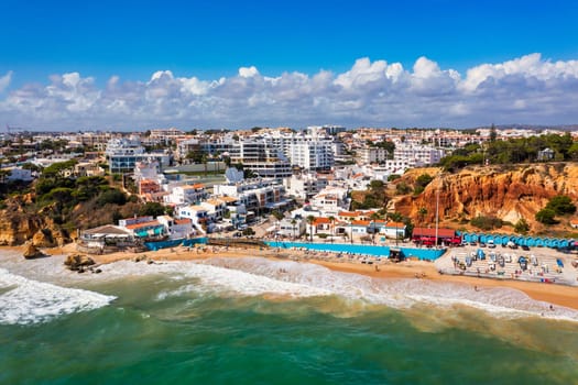 Amazing view from the sky of town Olhos de Agua in Albufeira, Algarve, Portugal. Aerial coastal view of town Olhos de Agua, Albufeira area, Algarve, Portugal.