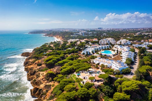 Amazing view from the sky of town Olhos de Agua in Albufeira, Algarve, Portugal. Aerial coastal view of town Olhos de Agua, Albufeira area, Algarve, Portugal.