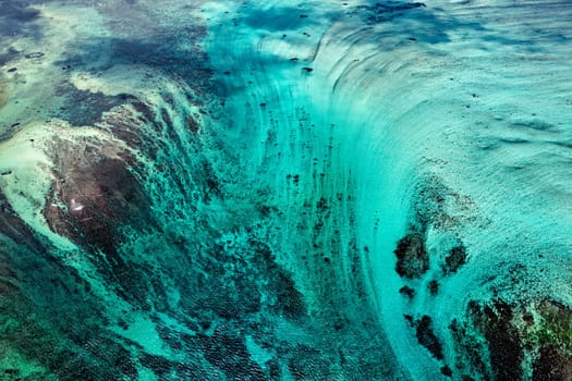 Aerial view of Underwater Waterfall in Mauritius, beautiful blue lagoon and underwater waterfall. Le Morne Brabant peninsula and Underwater Waterfall, Mauritius.