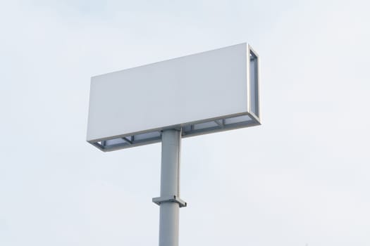 A large white sign stands on top of a metal pole against a white background, ready for display.