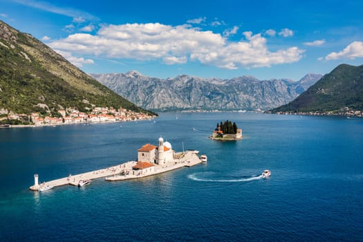 Saint George Island and Church of Our Lady of the Rocks in Perast, Montenegro. Our Lady of the Rock island and Church in Perast on shore of Boka Kotor bay (Boka Kotorska), Montenegro, Europe. 