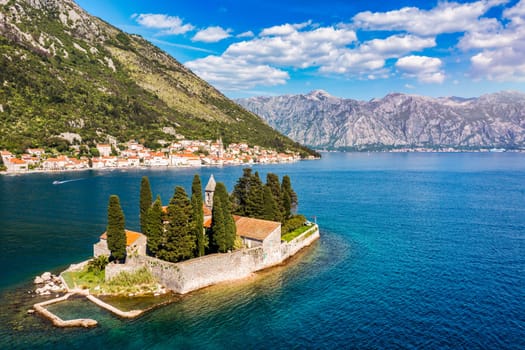 Saint George Island and Church of Our Lady of the Rocks in Perast, Montenegro. Our Lady of the Rock island and Church in Perast on shore of Boka Kotor bay (Boka Kotorska), Montenegro, Europe. 