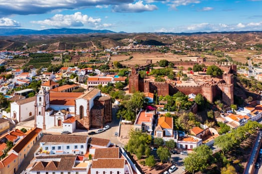 View of Silves town buildings with famous castle and cathedral, Algarve region, Portugal. Walls of medieval castle in Silves town, Algarve region, Portugal. 
