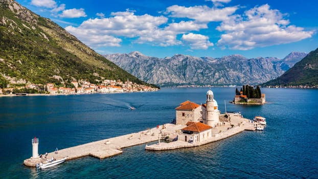 Saint George Island and Church of Our Lady of the Rocks in Perast, Montenegro. Our Lady of the Rock island and Church in Perast on shore of Boka Kotor bay (Boka Kotorska), Montenegro, Europe. 