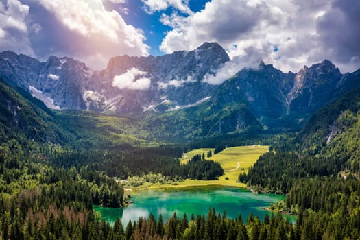 Lake of Fusine (Lago Superiore di Fusine) and the Mountain Range of Mount Mangart, Julian Alps, Tarvisio, Udine province, Friuli Venezia Giulia, Italy, Europe. Picturesque lake Lago Fusine in Italy.