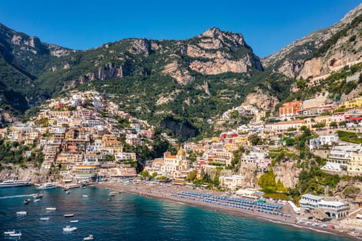 Aerial view of Positano with comfortable beach and blue sea on Amalfi Coast in Campania, Italy. Positano village on the Amalfi Coast, Salerno, Campania. Beautiful Positano, Amalfi Coast in Campania.