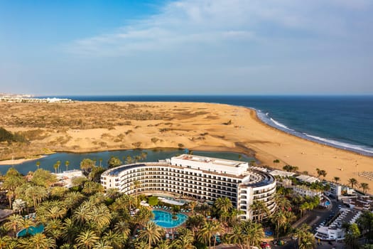 Landscape with Maspalomas town and golden sand dunes, Gran Canaria, Canary Islands, Spain. Natural Reserve of Dunes of Maspalomas, in Gran Canaria, Canary Islands, Spain.
