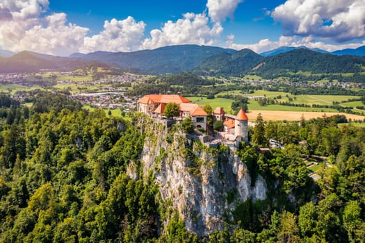 Bled, Slovenia, aerial view of beautiful Bled Castle (Blejski Grad) with Lake Bled (Blejsko Jezero), the Church of the Assumption of Maria on a bright summer day. Bled, Slovenia.