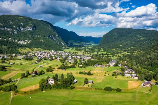 Aerial view of Stara fuzina village in Slovenia in Julian Alps. Popular touristic destination in Slovenia. Bohinj Lake, Church of St John the Baptist. Triglav National Park, Julian Alps, Slovenia. 