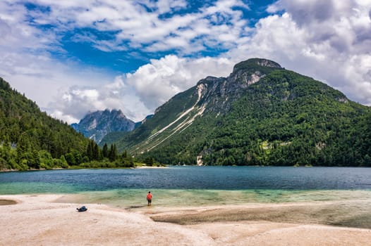 View to Julian Alps mountains above Predil lake in Italy with small lake. Predil Lake, Friuli Italy / (Lago del Predil), beautiful alpine lake in north Italy near the Slovenian border, Italy.