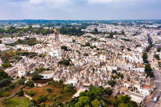 The traditional Trulli houses in Alberobello city, Apulia, Italy. Cityscape over the traditional roofs of the Trulli, original and old houses of this region, Apulia, Alberobello, Puglia, Italy. 