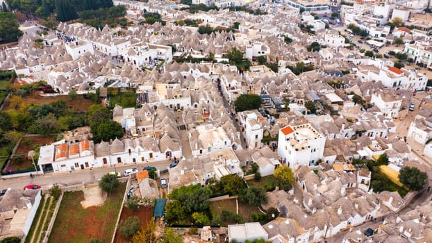 The traditional Trulli houses in Alberobello city, Apulia, Italy. Cityscape over the traditional roofs of the Trulli, original and old houses of this region, Apulia, Alberobello, Puglia, Italy. 