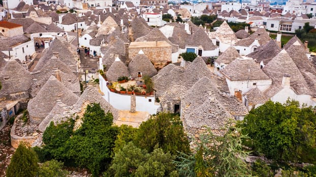 The traditional Trulli houses in Alberobello city, Apulia, Italy. Cityscape over the traditional roofs of the Trulli, original and old houses of this region, Apulia, Alberobello, Puglia, Italy. 