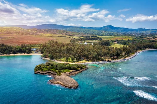 Aerial panoramic of waves of Indian Ocean and turquoise coral reef, Poste Lafayette, East coast, Mauritius. Turquoise coral reef meeting the waves of the Indian Ocean, Poste Lafayette, Mauritius.