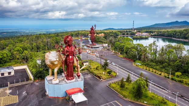 Shiva statue at Grand Bassin temple, the world's tallest Shiva temple, it is 33 meters tall. Important hindu temples of Mauritius. A large statue of the Hindu god Shiva, seen from above, Mauritius.