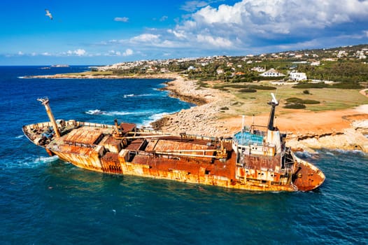 Abandoned Edro III Shipwreck at seashore of Peyia, near Paphos, Cyprus. Historic Edro III Shipwreck site on the shore of the water in Cyprus. Aerial view of Shipwreck EDRO III, Pegeia, Paphos.