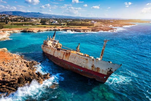 Abandoned Edro III Shipwreck at seashore of Peyia, near Paphos, Cyprus. Historic Edro III Shipwreck site on the shore of the water in Cyprus. Aerial view of Shipwreck EDRO III, Pegeia, Paphos.