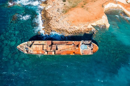 Abandoned Edro III Shipwreck at seashore of Peyia, near Paphos, Cyprus. Historic Edro III Shipwreck site on the shore of the water in Cyprus. Aerial view of Shipwreck EDRO III, Pegeia, Paphos.
