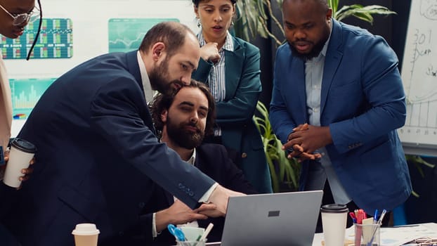 Research team presenting all insight and statistics data they found online, briefing their manager about the work progress and achievements. Employees showing gathered info. Camera A.