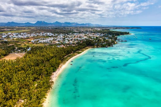 Mauritius beach aerial view of Mont Choisy beach in Grand Baie, Pereybere North. Mont Choisy, public beach in Mauritius island, Africa. Beautiful beach of Mont Choisy in Mauritius, drone aerial view.