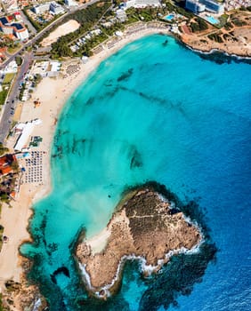 Aerial view of beautiful Nissi beach in Ayia Napa, Cyprus. Nissi beach in Ayia Napa famous tourist beach in Cyprus. A view of a azzure water and Nissi beach in Aiya Napa, Cyprus.