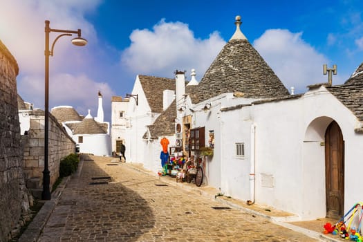 The traditional Trulli houses in Alberobello city, Apulia, Italy. Cityscape over the traditional roofs of the Trulli, original and old houses of this region, Apulia, Alberobello, Puglia, Italy. 