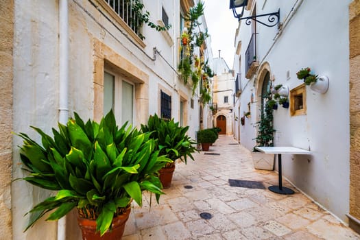 Scenic sight in Locorotondo, Bari Province, Apulia (Puglia), Italy. Characteristic streets in the Locorotondo in Puglia, Italy. Locorotondo is a town of the Metropolitan City of Bari, Apulia, Italy.