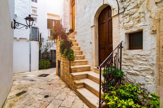 Scenic sight in Locorotondo, Bari Province, Apulia (Puglia), Italy. Characteristic streets in the Locorotondo in Puglia, Italy. Locorotondo is a town of the Metropolitan City of Bari, Apulia, Italy.