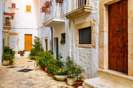 Scenic sight in Locorotondo, Bari Province, Apulia (Puglia), Italy. Characteristic streets in the Locorotondo in Puglia, Italy. Locorotondo is a town of the Metropolitan City of Bari, Apulia, Italy.