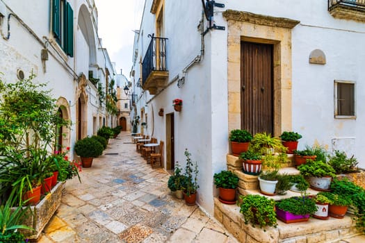 Scenic sight in Locorotondo, Bari Province, Apulia (Puglia), Italy. Characteristic streets in the Locorotondo in Puglia, Italy. Locorotondo is a town of the Metropolitan City of Bari, Apulia, Italy.