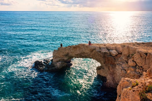 Beautiful bridge of lovers natural rock arch near of Ayia Napa, Cavo Greco and Protaras on Cyprus island, Mediterranean Sea. Legendary bridge lovers. Amazing blue green sea and sunny day