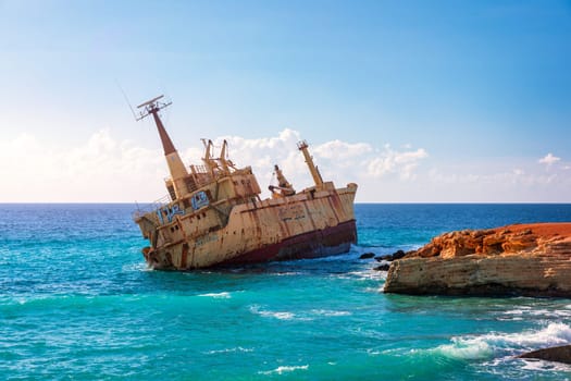 Abandoned Edro III Shipwreck at seashore of Peyia, near Paphos, Cyprus. Historic Edro III Shipwreck site on the shore of the water in Cyprus. Aerial view of Shipwreck EDRO III, Pegeia, Paphos.