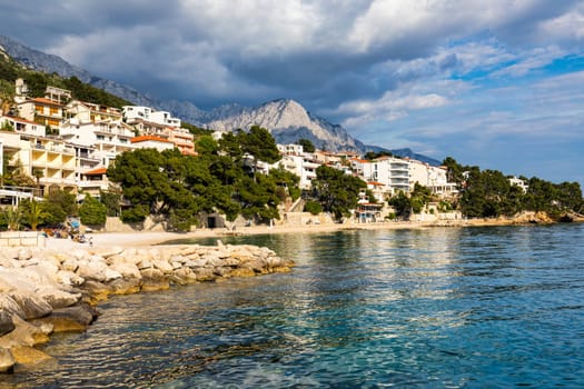 Beautiful Brela on Makarska riviera, Croatia. Adriatic Sea with amazing turquoise clean water and white sand. Aerial view of Brela town and waterfront on Makarska riviera, Dalmatia region of Croatia.