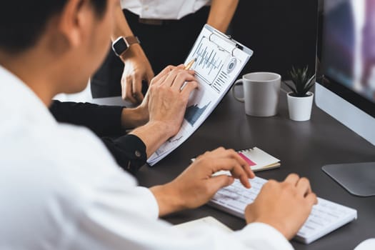 Group of diverse office worker employee working together on strategic business marketing planning in corporate office room. Positive teamwork in business workplace concept. Prudent