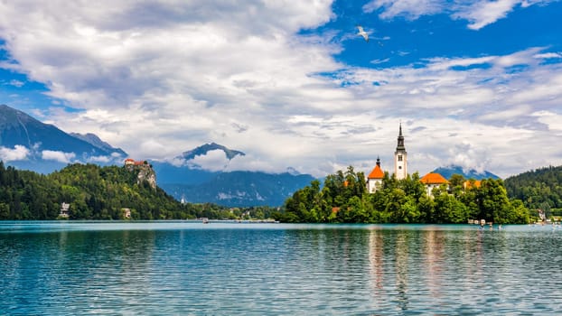 Lake Bled in Slovenia. Beautiful mountains and Bled lake with small Pilgrimage Church. Bled lake and island with Pilgrimage Church of the Assumption of Maria. Bled, Slovenia, Europe.