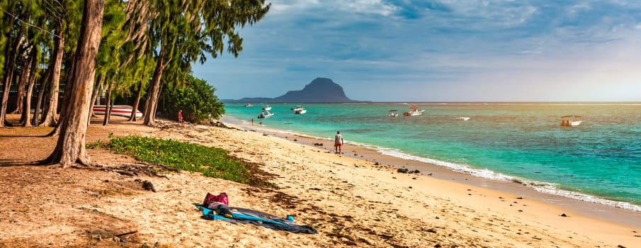 Beach of Flic en Flac with beautiful peaks in the background, Mauritius. Beautiful Mauritius Island with gorgeous beach Flic en Flac. Flic en Flac Beach, Mauritius Island.