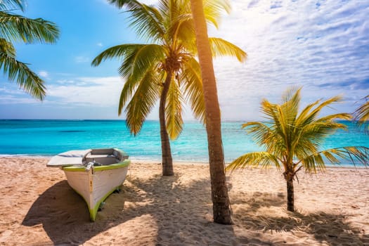 A beach with palm trees and umbrellas on Le morne Brabant beach in Mauriutius. Tropical crystal ocean with Le Morne beach and luxury beach in Mauritius. Le Morne beach with palm trees, white sand and luxury resorts, Mauritius.