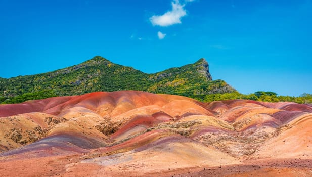 Chamarel Seven Colored Earth Geopark in Mauritius Island. Colorful panoramic landscape about this volcanic geological formation Chamarel Seven Colored Earth Geopark in Riviere noire district.