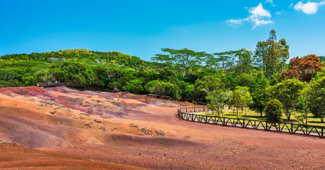 Chamarel Seven Colored Earth Geopark in Mauritius Island. Colorful panoramic landscape about this volcanic geological formation Chamarel Seven Colored Earth Geopark in Riviere noire district.