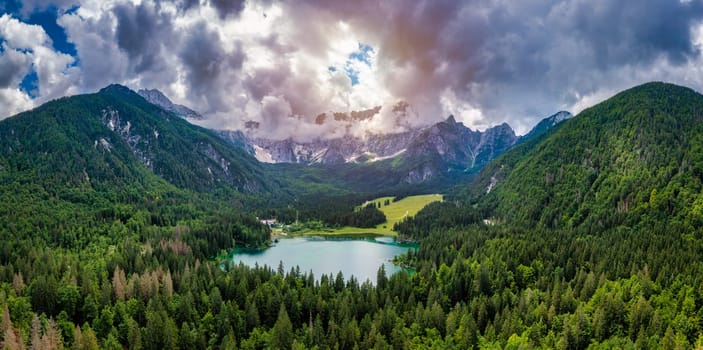 Lake of Fusine (Lago Superiore di Fusine) and the Mountain Range of Mount Mangart, Julian Alps, Tarvisio, Udine province, Friuli Venezia Giulia, Italy, Europe. Picturesque lake Lago Fusine in Italy.