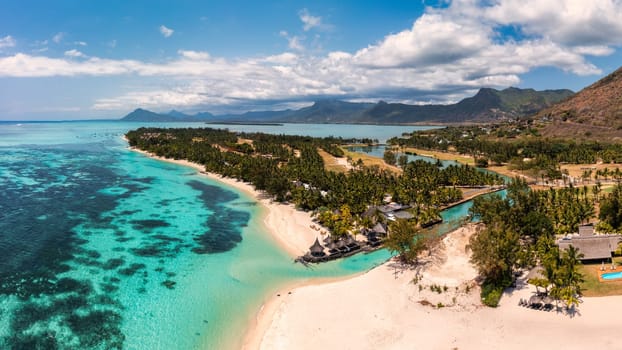 Beach with palm trees and umbrellas on Le morne beach in Mauriutius. Luxury tropical beach and Le Morne mountain in Mauritius. Le Morne beach with palm trees, white sand and luxury resorts, Mauritius