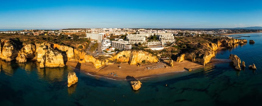 Praia de Dona Ana beach with turquoise sea water and cliffs, Portugal. Beautiful Dona Ana Beach (Praia Dona Ana) in Lagos, Algarve, Portugal. Praia de Dona Ana in Lagos in the Algarve, Portugal.