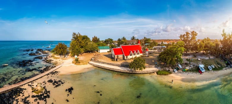 Red church at Cap Malheureux village, Mauritius Island. Notre Dame de Auxiliatrice, rural church with red roof in Cap Malheureux tropical village on Mauritius island, Indian Ocean.