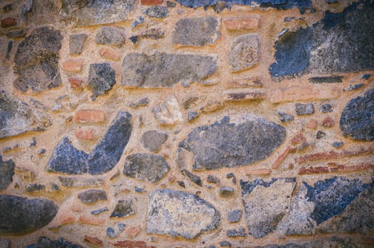 Full frame of a facade of a wall of stone constructed with volcanic rocks of origin 4